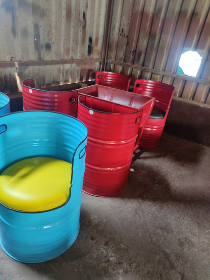 Vibrant upcycled drum chairs by Gigantiques, eco-friendly metal barrel furniture for modern cafes and homes in Mumbai and Pune.