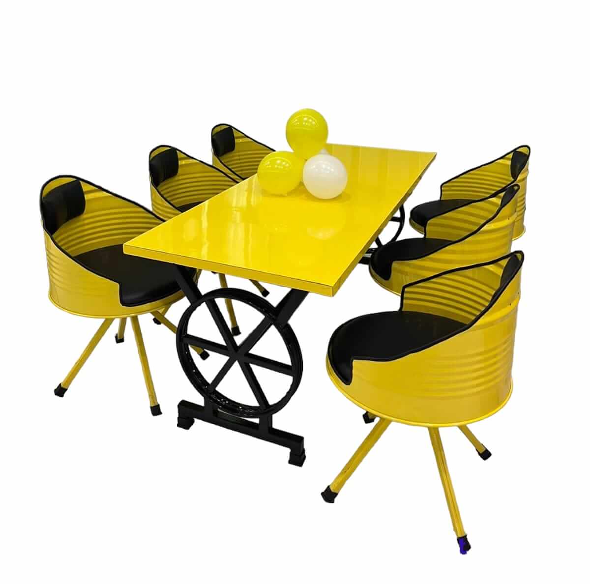 Yellow metal drum chair set with bike rim table by Gigantiques; eco-friendly and upcycled dining furniture from Pune manufacturer.